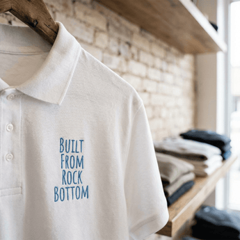 Built From Rock Bottom Embroidered Polo Shirt | Premium Recovery Apparel | Sobervation - White Embroidered Pique Polo Shirt - Sobervation
