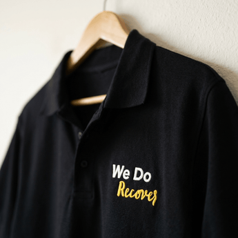 We Do Recover Embroidered Polo Shirt | The Original Sobervation Message | Premium Recovery Apparel - Black Embroidered Pique Polo Shirt - Sobervation