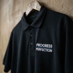 Progress / Perfection Embroidered Polo Shirt | Premium Recovery Apparel | Sobervation - Black Embroidered Pique Polo Shirt - Sobervation